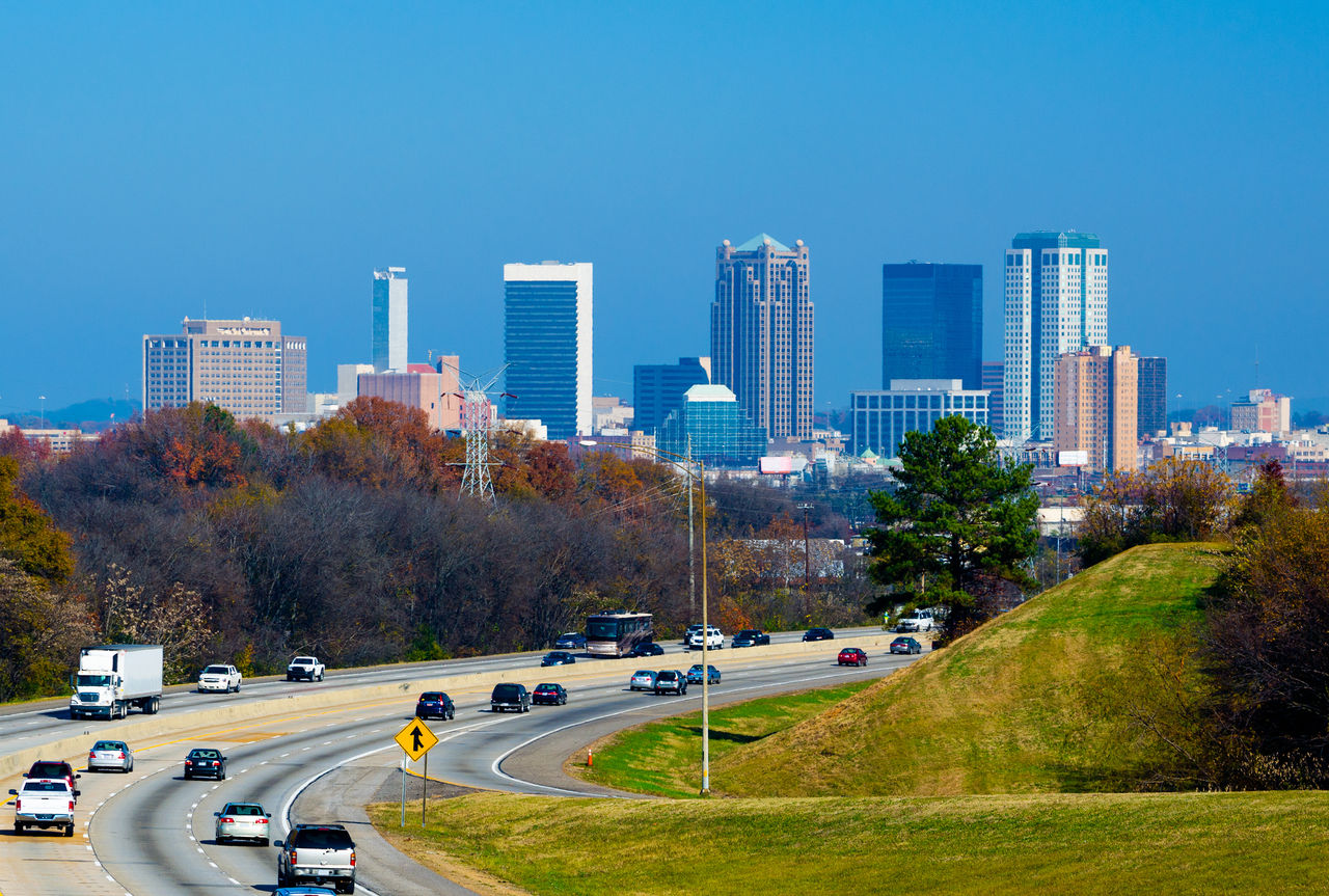 Birmingham city skyline with I-65 highway in the foreground.