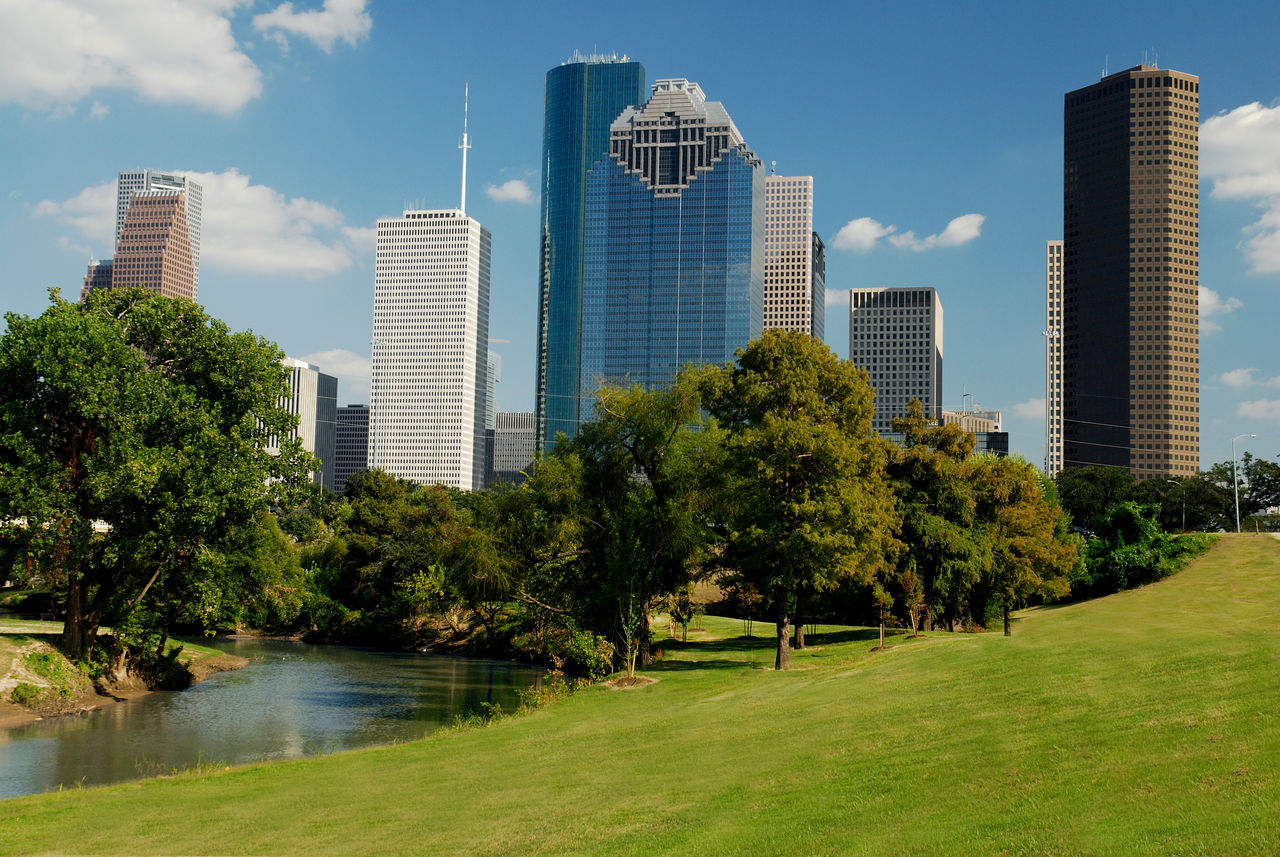 Image of a Houston skyline and city park on the west side. 